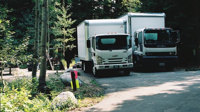 white and black truck on road during daytime